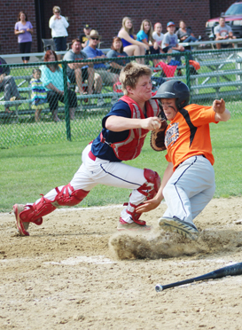 Bailey Volk avoids a tag by FLAG catcher Noah Coffman.